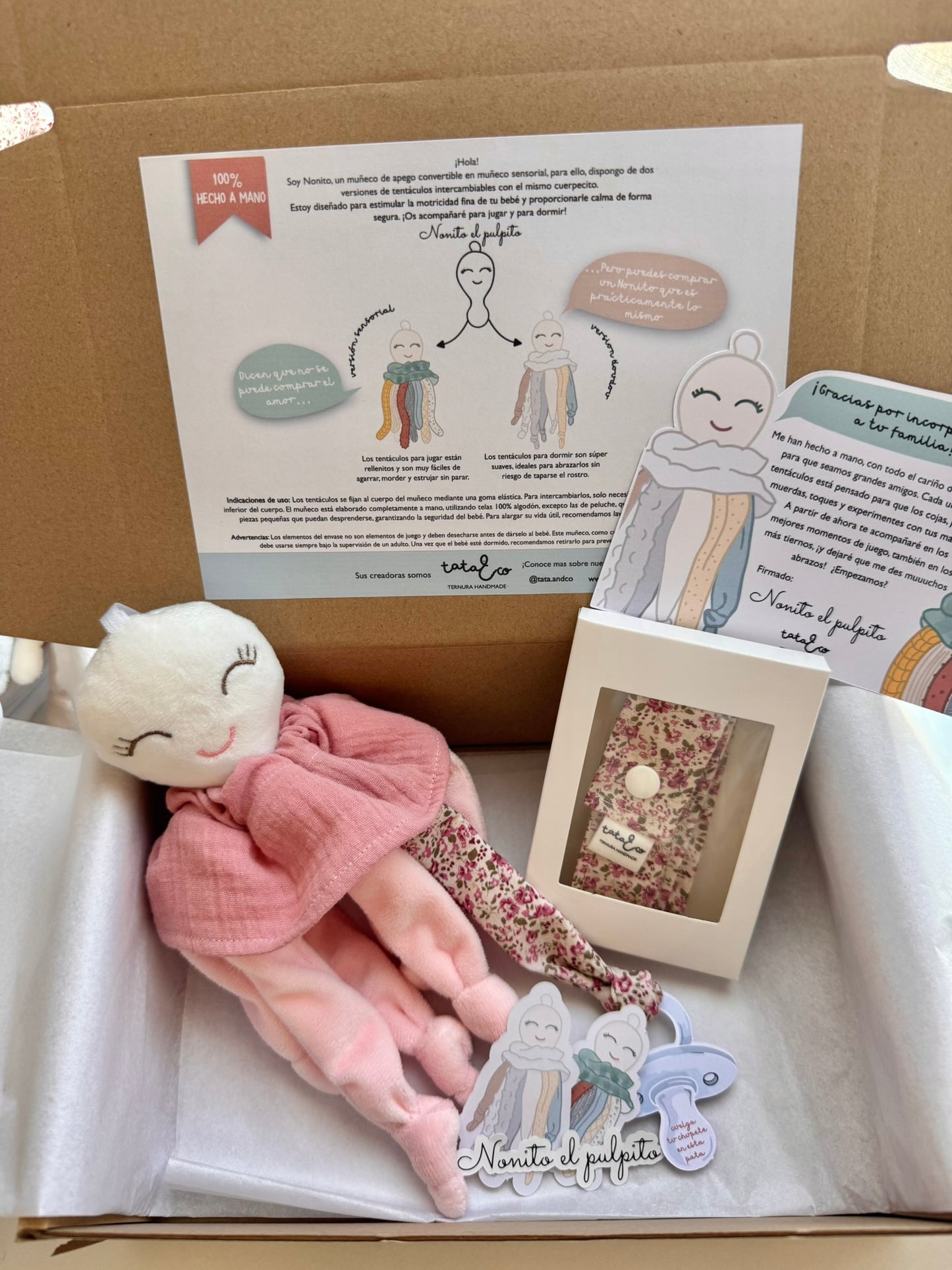 Nonito doudou rosa + cinta cuelga juguetes