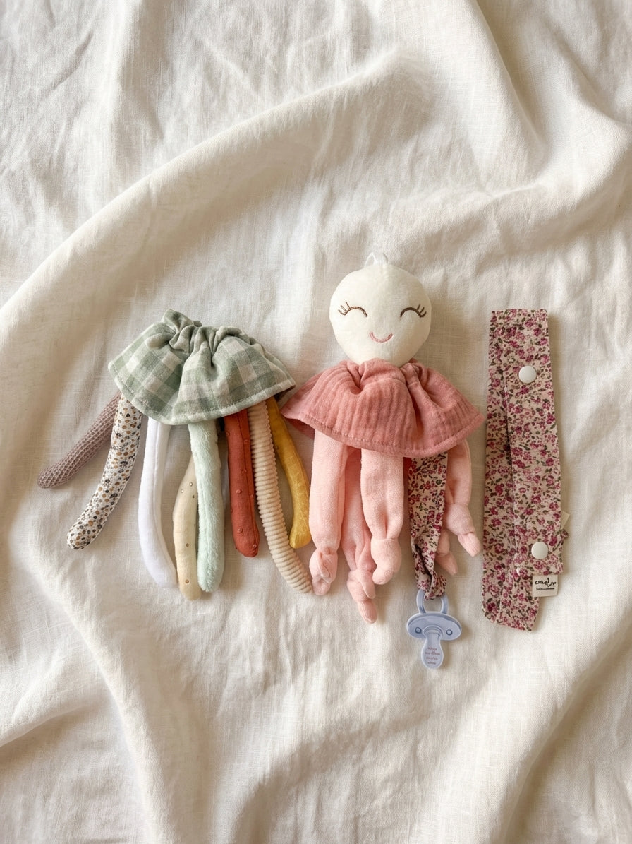 Pack Nonito sensorial y doudou rosa + Cinta cuelga juguetes